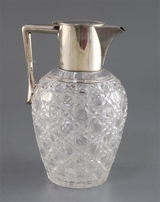 An Edwardian silver mounted cut glass claret jug, John Grinsell & Sons, 19.2cm.